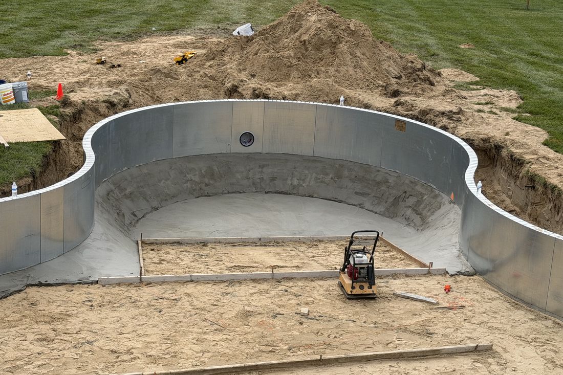 Custom steel vinyl pool wall formed to fit the yard